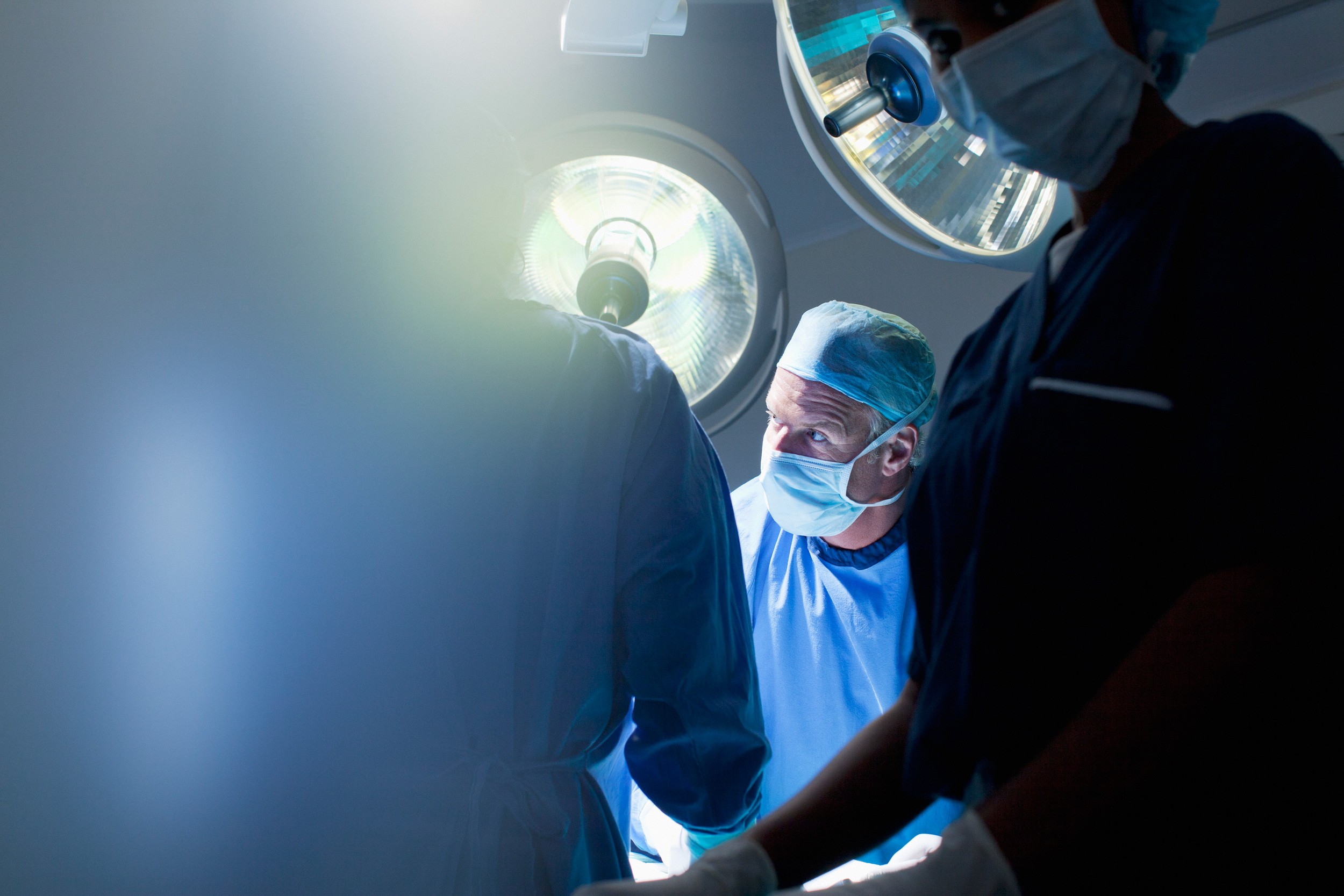 Surgical team working under bright lights