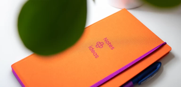 A pen next to a notepad labelled Notes and ideas