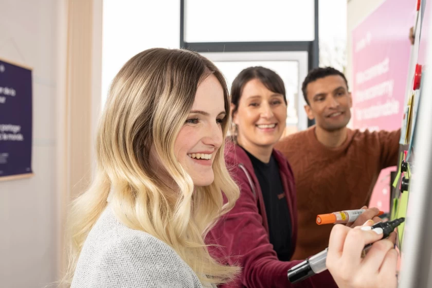 Unitees working on a whiteboard