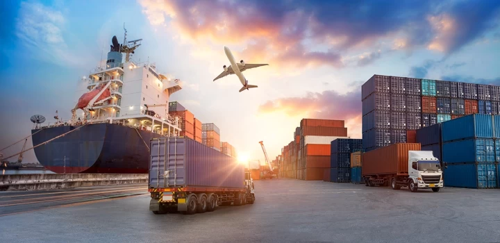 Logistics and transport of container cargo ship and cargo aircraft with crane bridge in shipyard at sunrise.