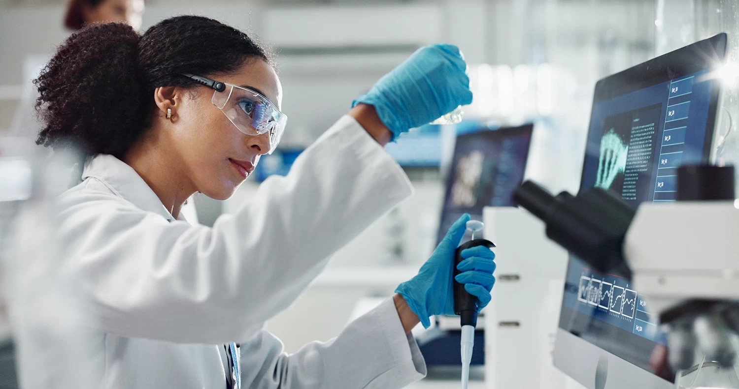 Scientists working on their computers in modern laboratory