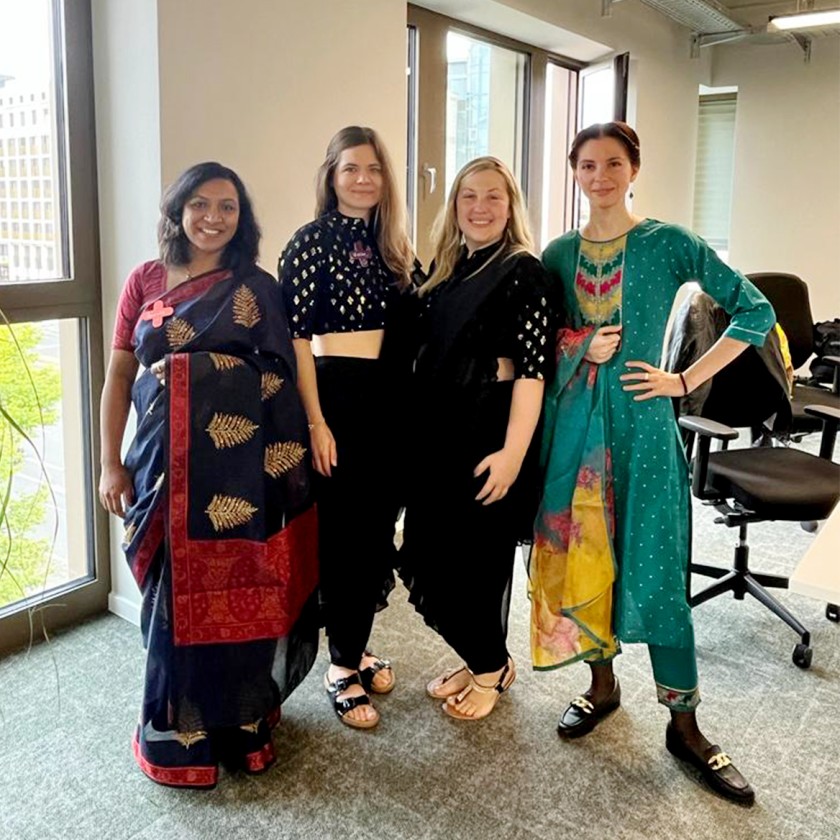 Four Unitees wearing traditional Indian outfits