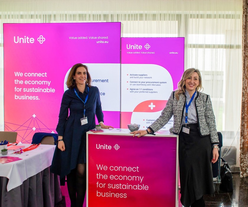 Unite Board Member Christel Constant and VP, Marketing and Brand, Erika Mizun-Moller, pose at the Unite booth.